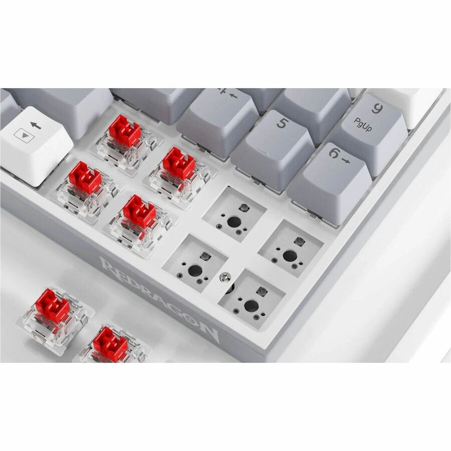 Mechanical keyboard switch area with red switches and clear translucent housings