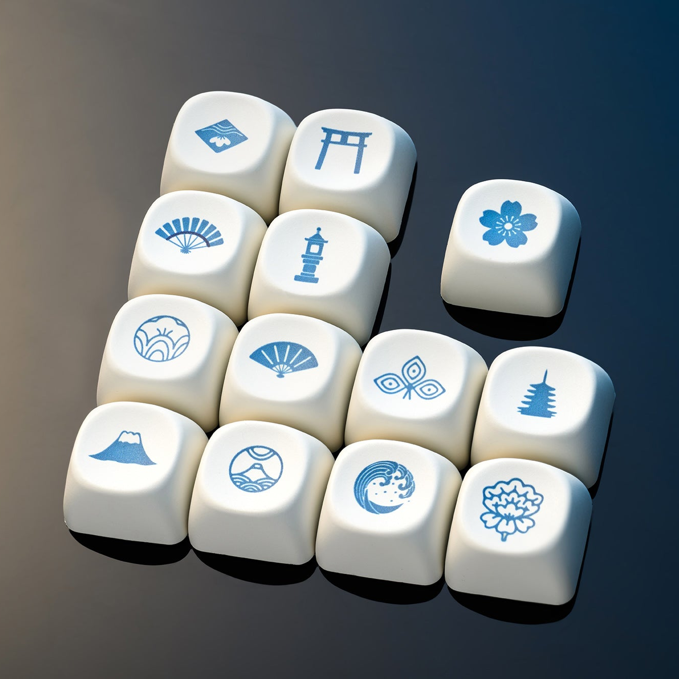 Cluster of white MOA-profile keycaps with blue landscape icons and symbols