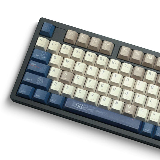 Cherry-profile keycap set with cream and blue keys, arranged on a black keyboard frame