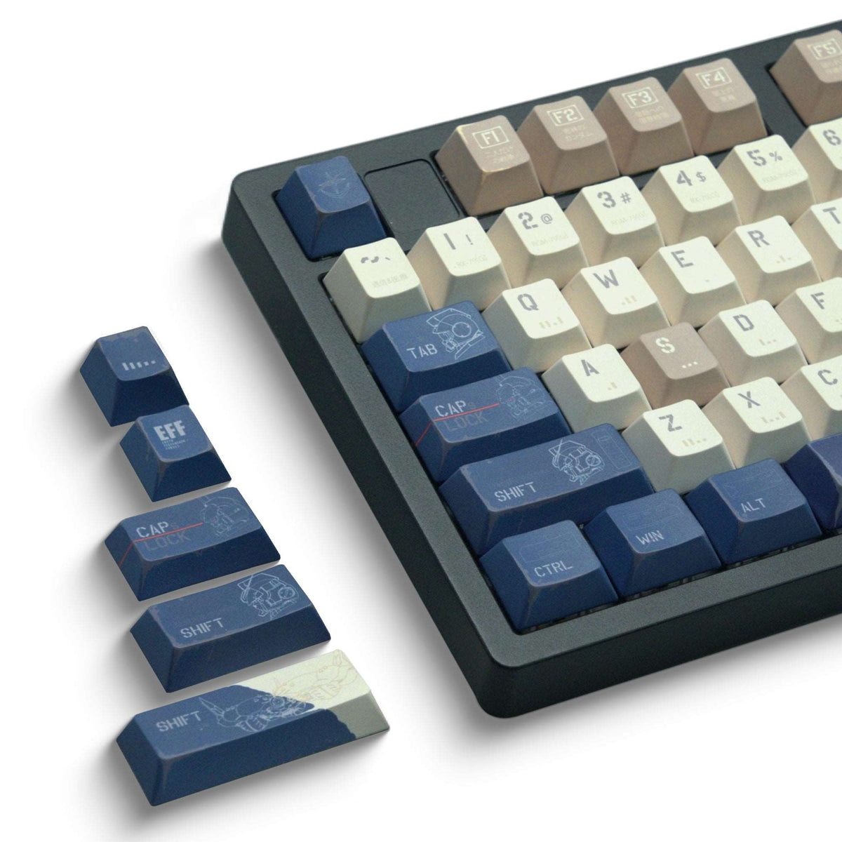 Cherry-profile keycap set in cream and blue on a black keyboard, with a few loose keys