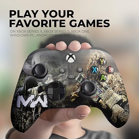 Xbox Series X controller with camo print held in a hand over the grips