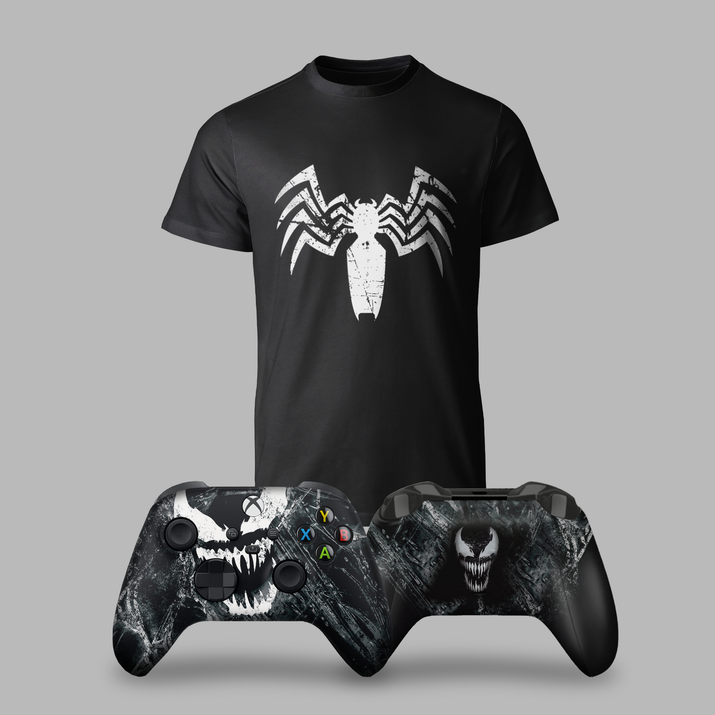 Black graphic T-shirt with white spider emblem; two Xbox controllers with ABXY buttons