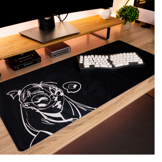 Black desk mat with white anime-style portrait and gaming icons graphic