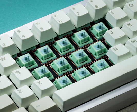 HMX Frog tactile switches installed on keyboard, mint green caps and white keytops