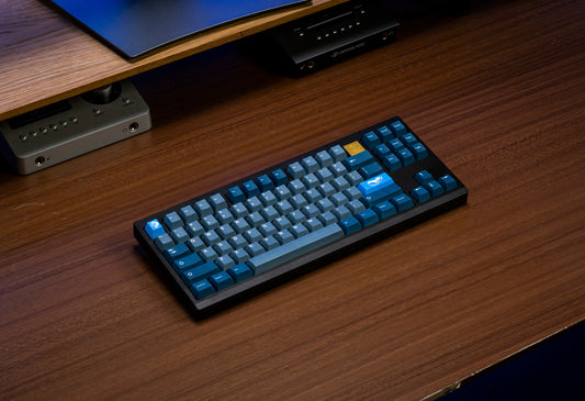 Blue keycap set on keyboard, showing arrow and number keys