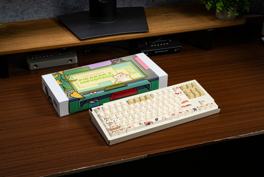 PBT keycap set in box on desk, cream keycaps with cute character themed legends