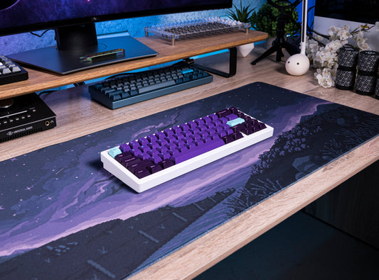 Galaxy PBT keycaps on white keyboard with purple keys and light-blue Enter key