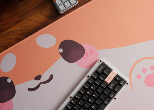 Shiba dog desk mat with dog-face design, shown with keyboard at the edge