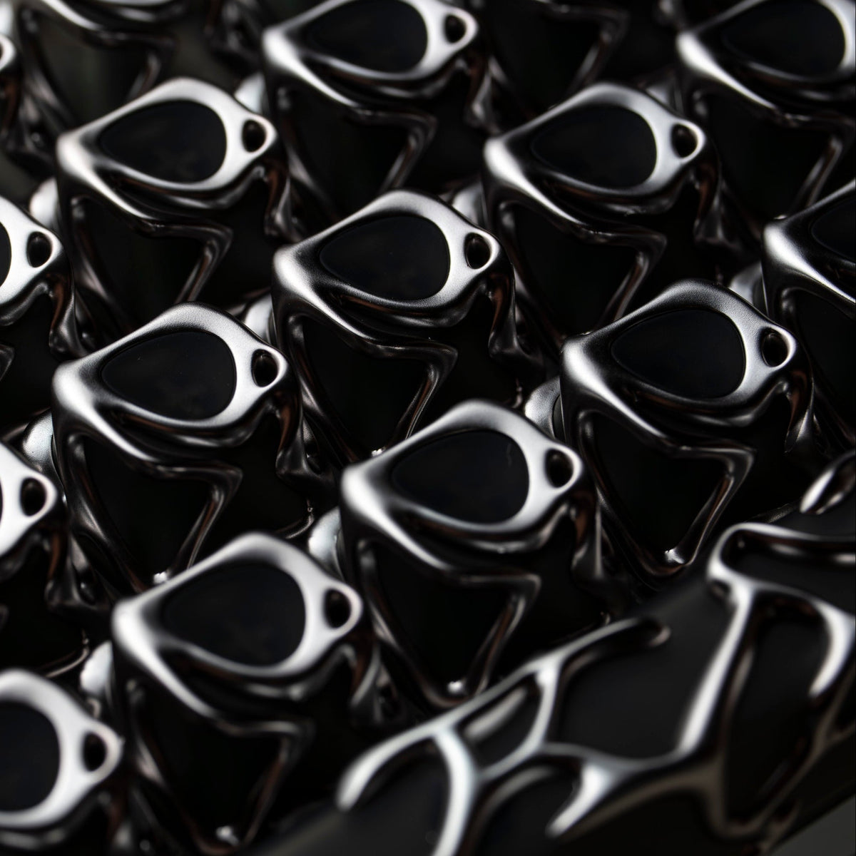 Silver liquid metallic keycaps close-up with glossy curved legends