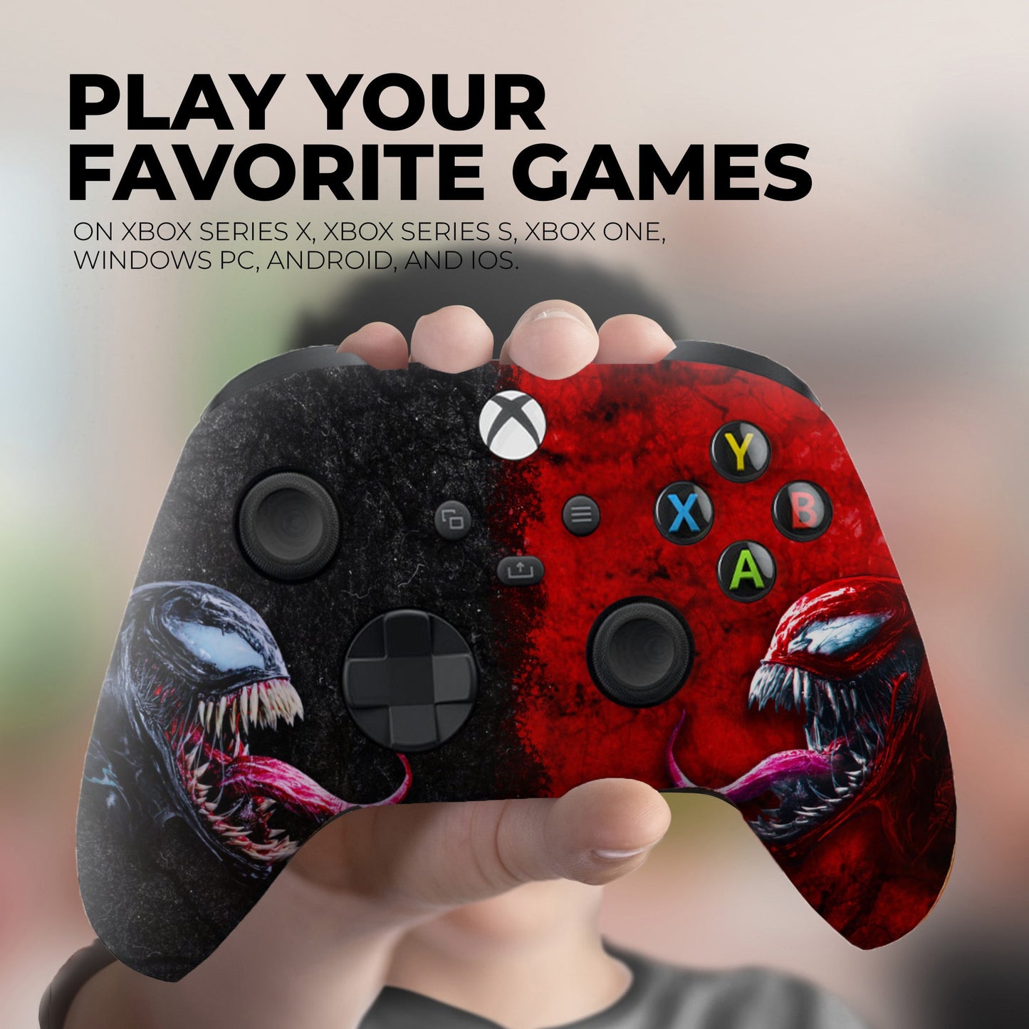 Close-up of Xbox controller in hand, red and black artwork with Y, X, B, and A buttons