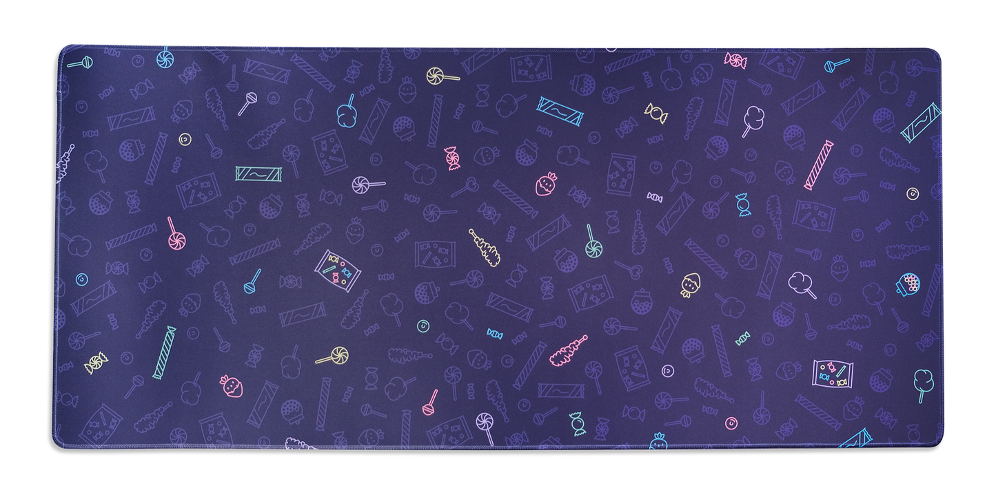 Candy shop desk mat with purple, multicolor candy pattern and rounded edges