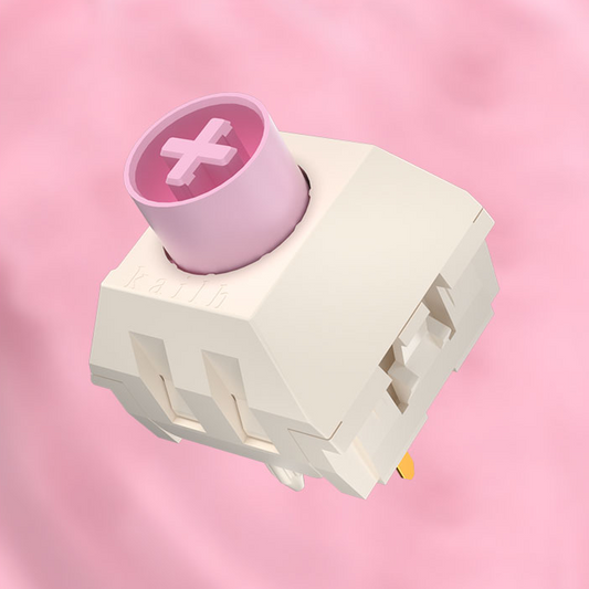 Kailh box mechanical switch, pale housing and pink stem, side view with clips