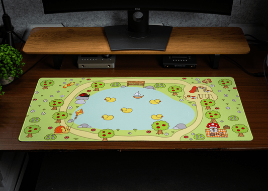 Picnic desk mat laid on table with blue center, lemons, and mushroom characters