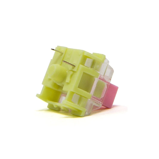 TTC Gold Pink V2 keyboard switch, translucent yellow body with pink side element, angled view