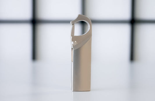 Silver-gray clip USB flash drive, side view with protective housing