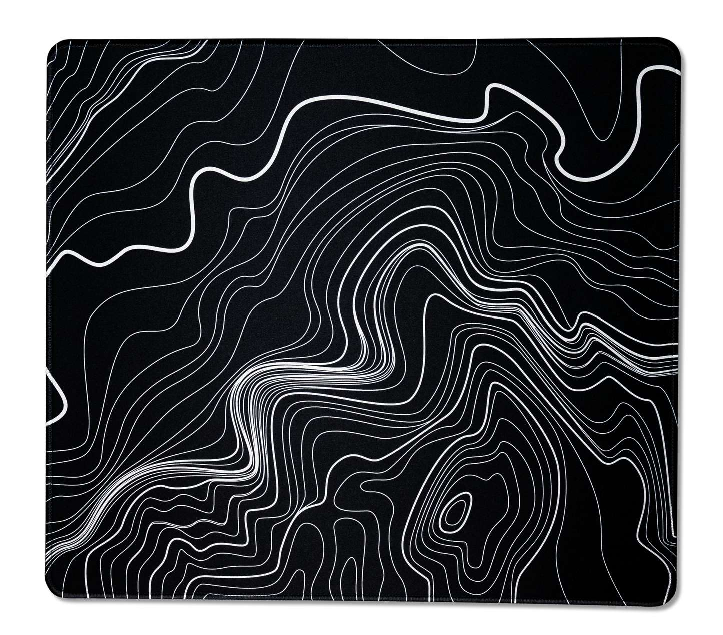 Black desk mat with white topographic line pattern, close-up of contour lines