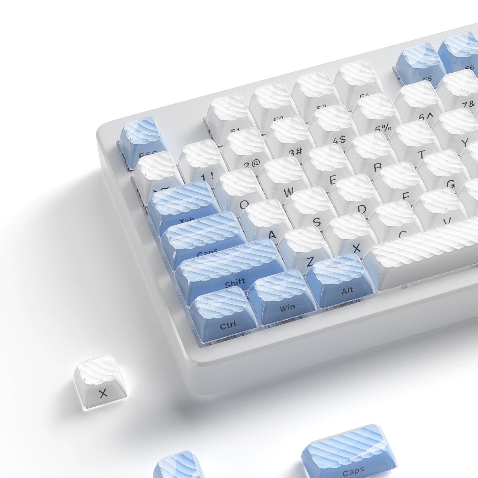 Blue and white OEM profile keycap set with sculpted legends on a clear tray