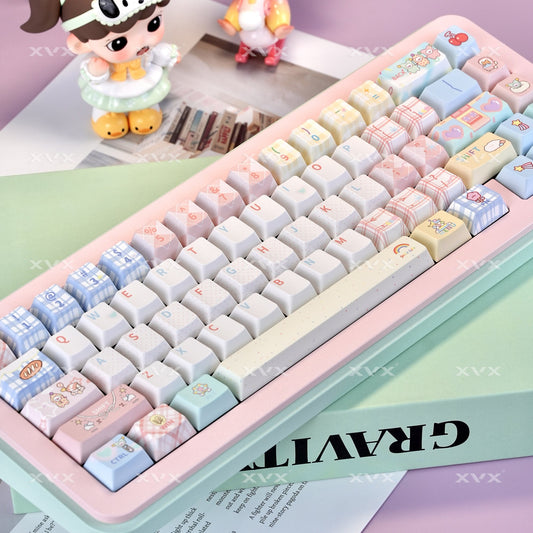 Cherry-themed keyboard keycaps with light blue, white, and pastel plaid patterns on mint base