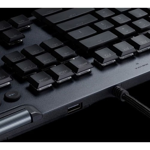 Black mechanical keyboard with illuminated keycaps, textured body, and USB ports