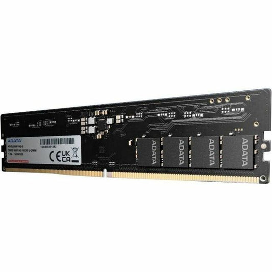 DDR5 SDRAM memory module with black PCB and gold edge connector