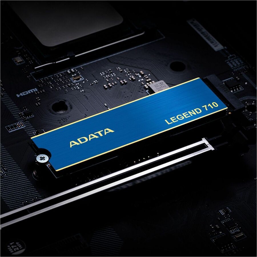 Adata LEGEND 710 NVMe M.2 2280 SSD on motherboard, close-up of blue ADATA/LEGEND 710
