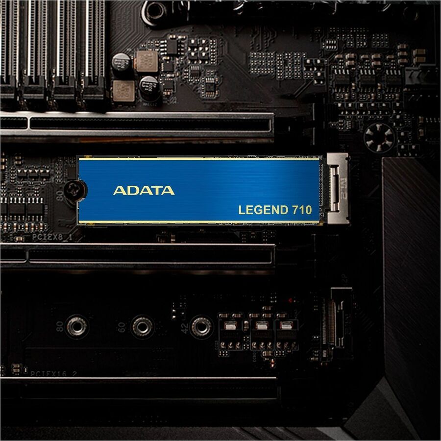 Adata LEGEND 710 NVMe M.2 2280 SSD installed on a motherboard, blue label visible