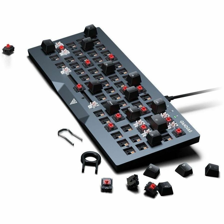 Mechanical keyboard PCB with black base, red switches, and assorted key parts