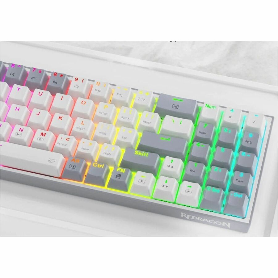 Redragon K628 keyboard close-up with white keycaps and multicolor RGB glow