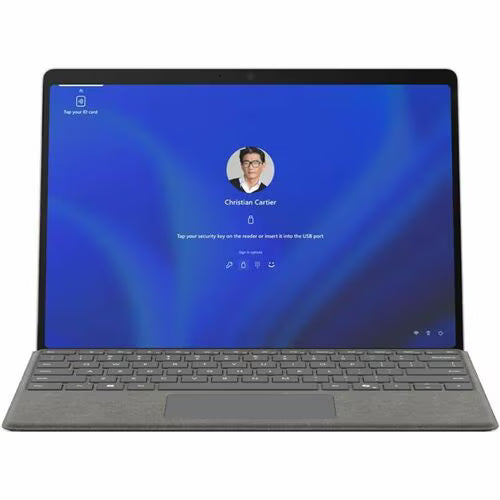 2-in-1 tablet computer in laptop mode with grey keyboard and blue startup screen