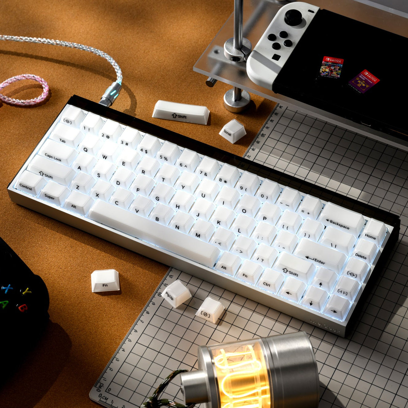 White translucent cherry-profile keycaps with blue legends on a keyboard tray.