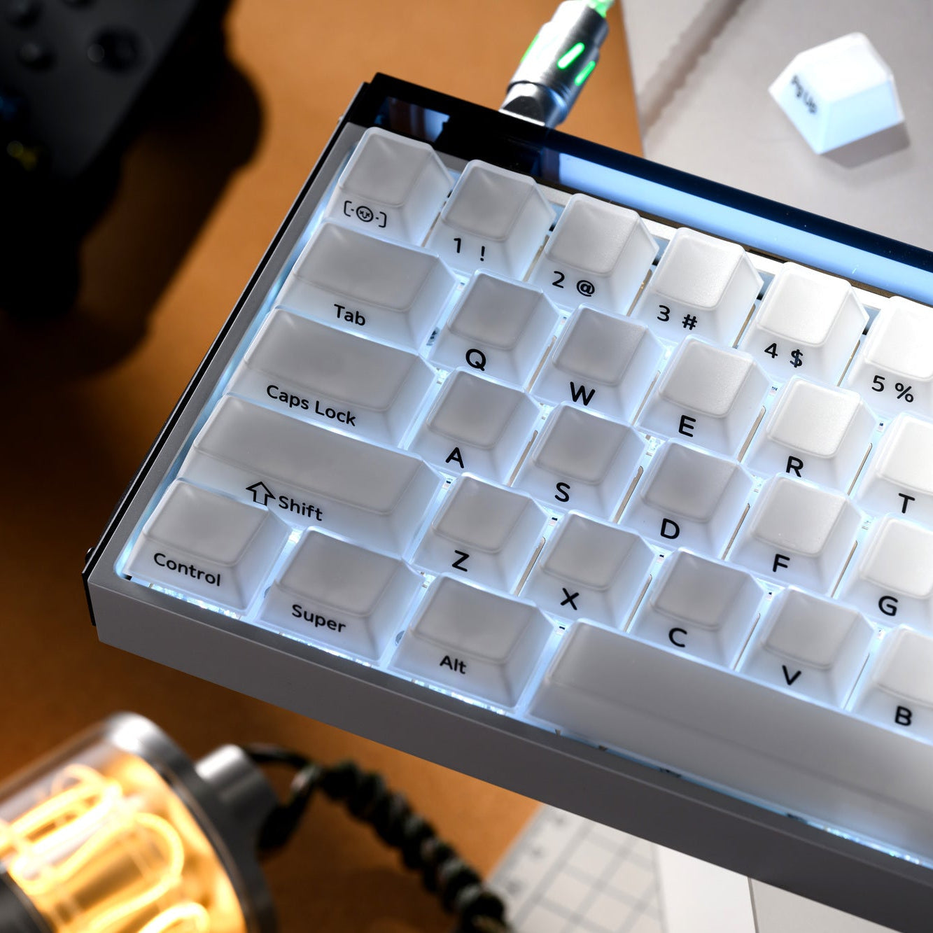 Cherry-profile keycap set with white translucent caps and blue legends, close angle.