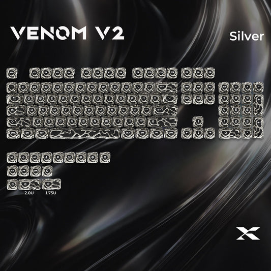 Silver metallic keycap set with engraved symbols, full keyboard layout