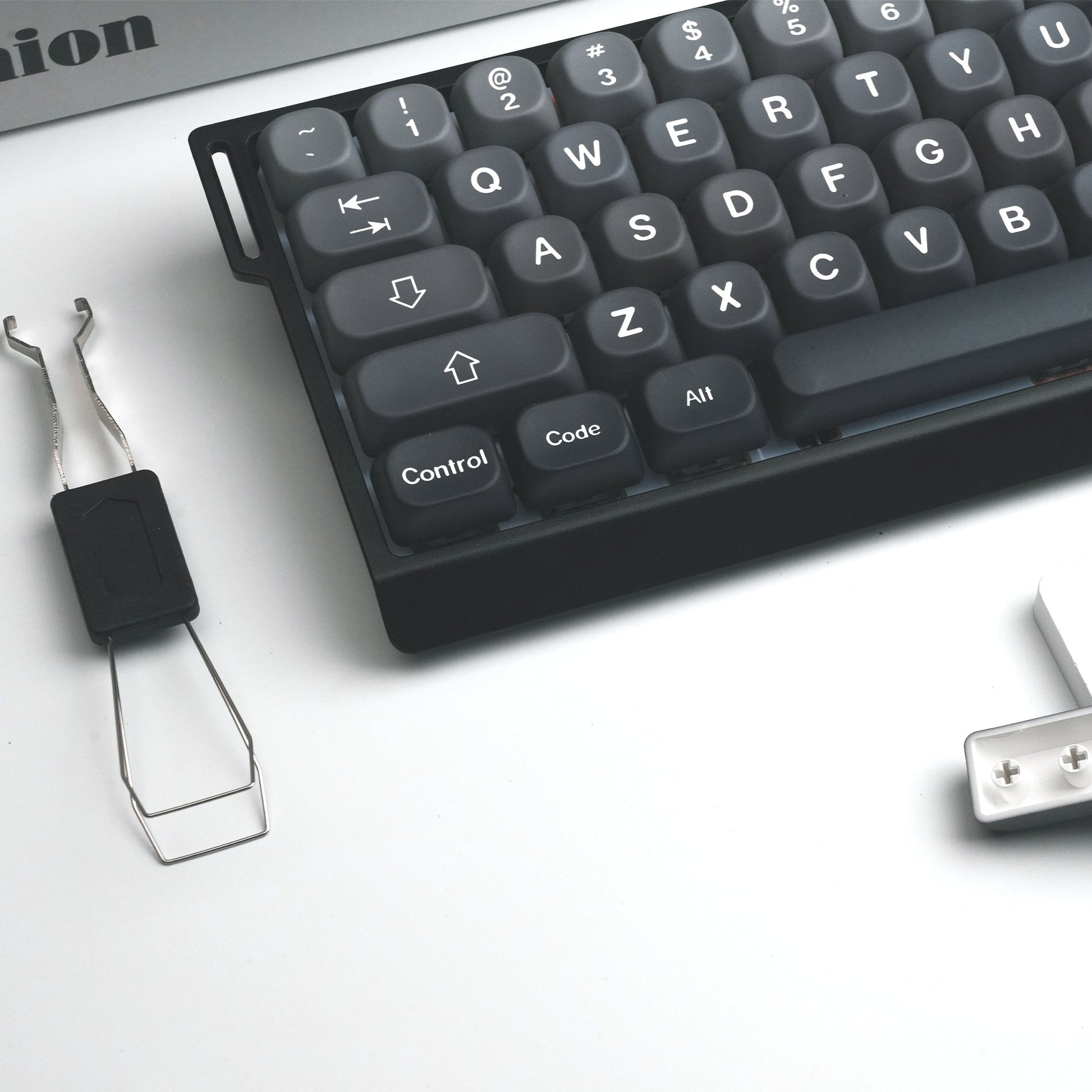 Dark gray PBT keycaps close-up, Control, Code, All and arrow keys