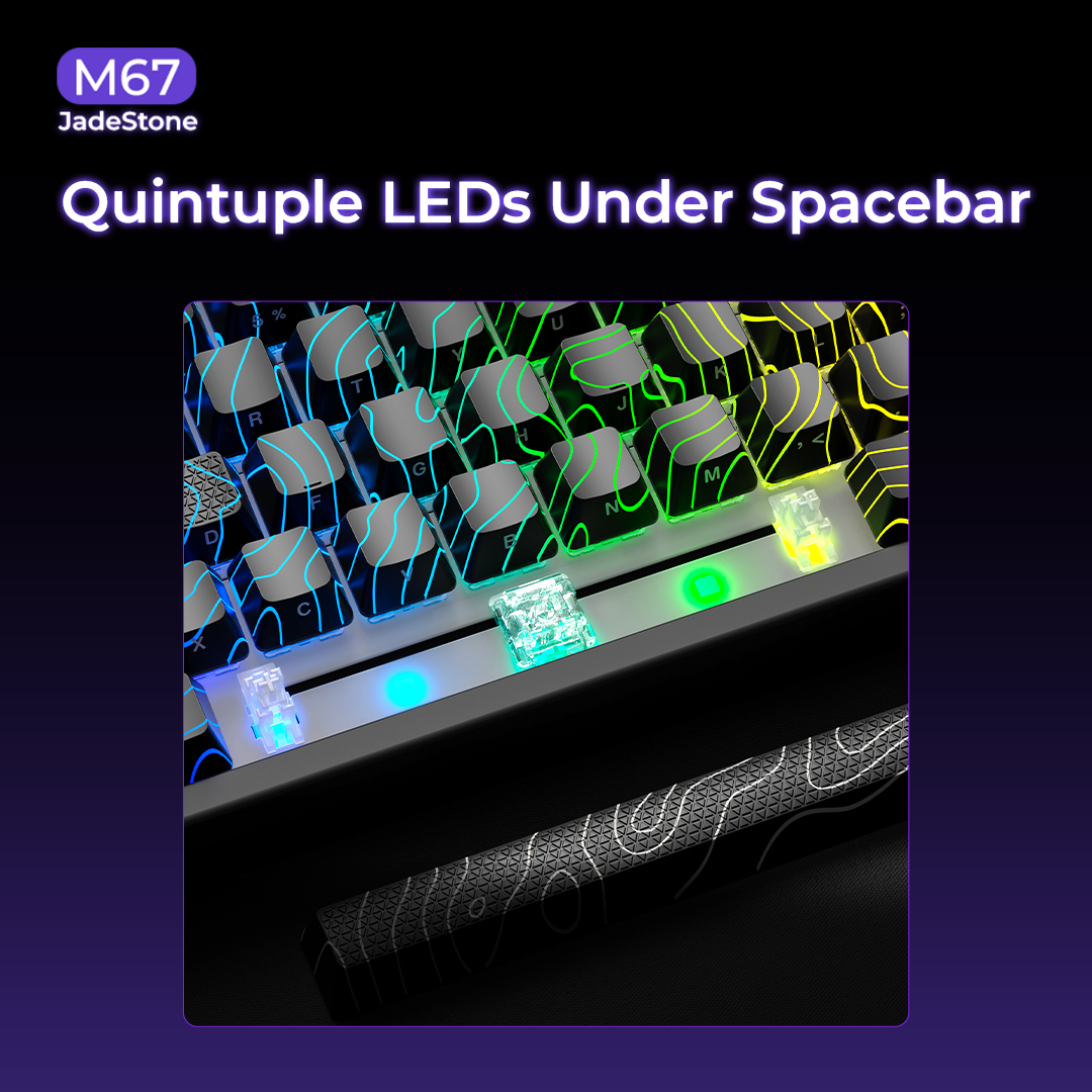 Mechanical keyboard spacebar area with multiple RGB LEDs and bright blue key highlights