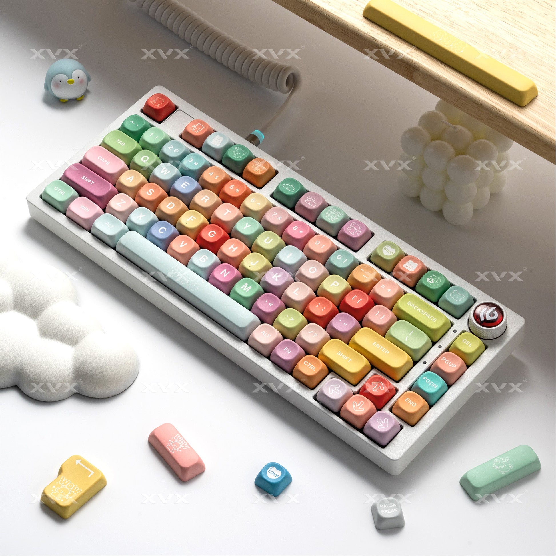 Pastel PBT keycap set with colorful letter legends and detached keycap pieces