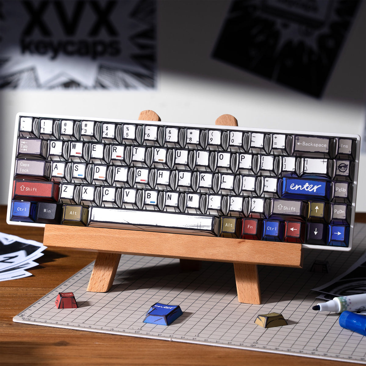 Keycap set on a wooden keyboard stand with black, white, and blue legends