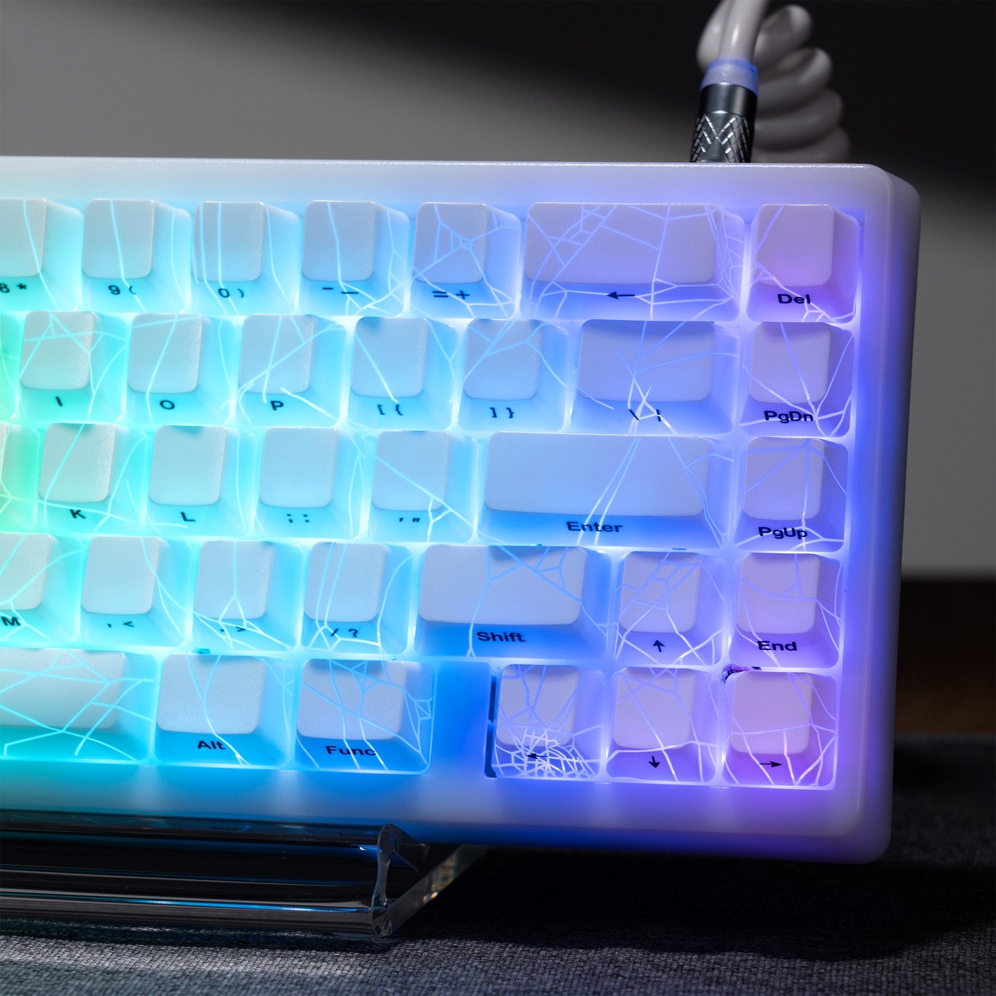 Bright blue backlit 118-key keycap set with spider-web shine-through design