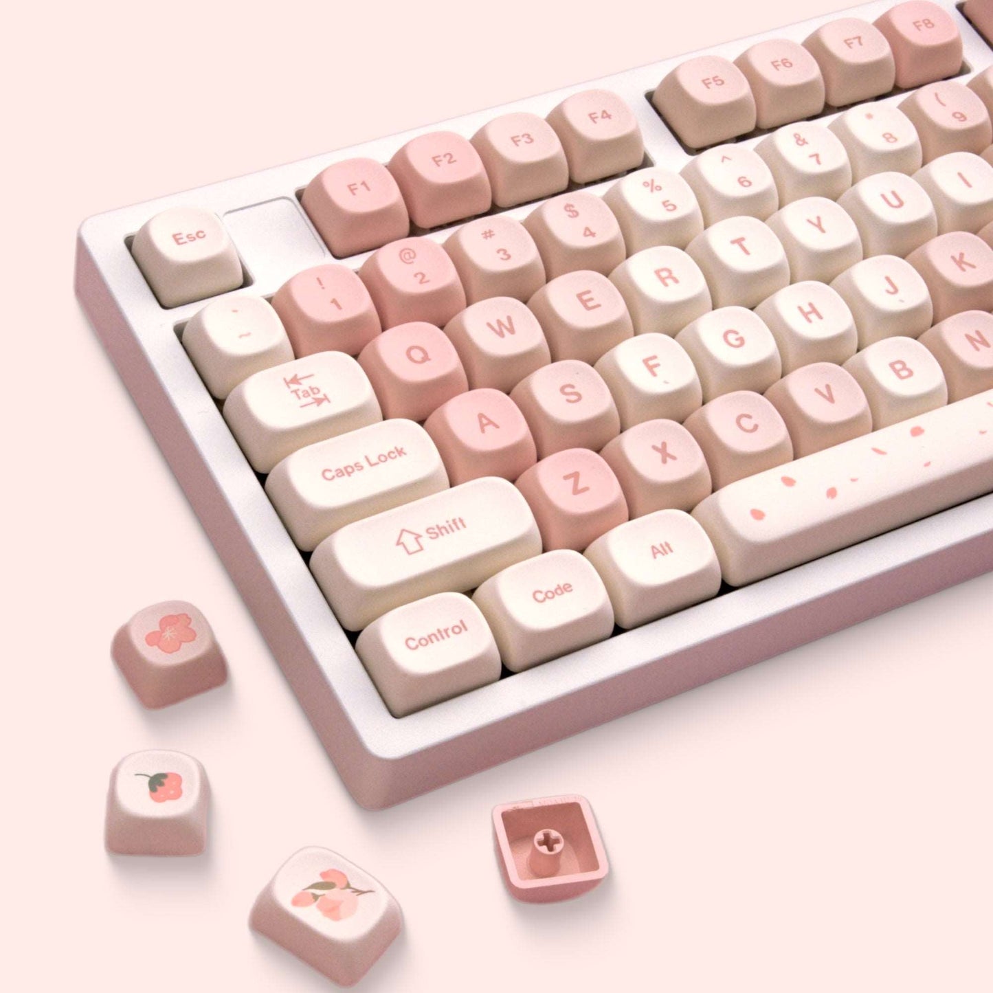 Cream and pink keycaps with cherry blossom graphics on control, shift, and Enter