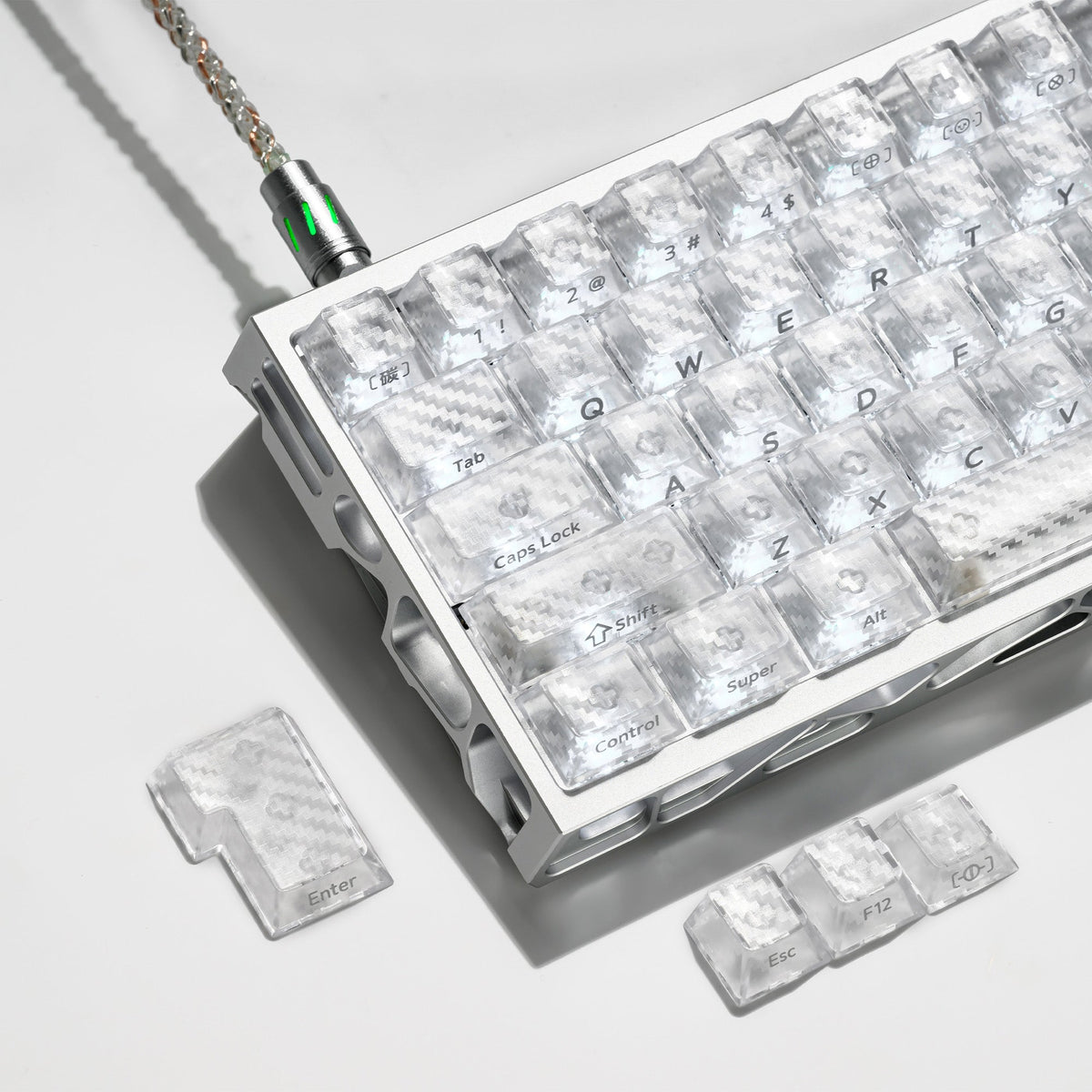 Clear cherry-profile keycaps with engraved legends installed on keyboard plate