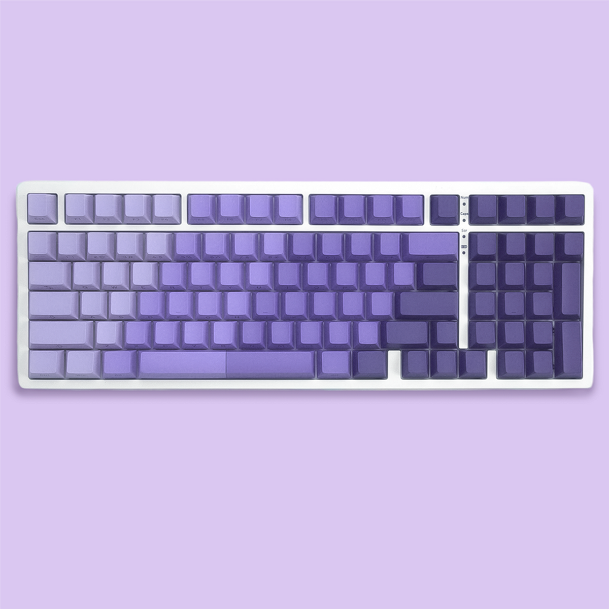 Cherry profile PBT keycaps with side-printed legends, dark navy and lavender gradient.