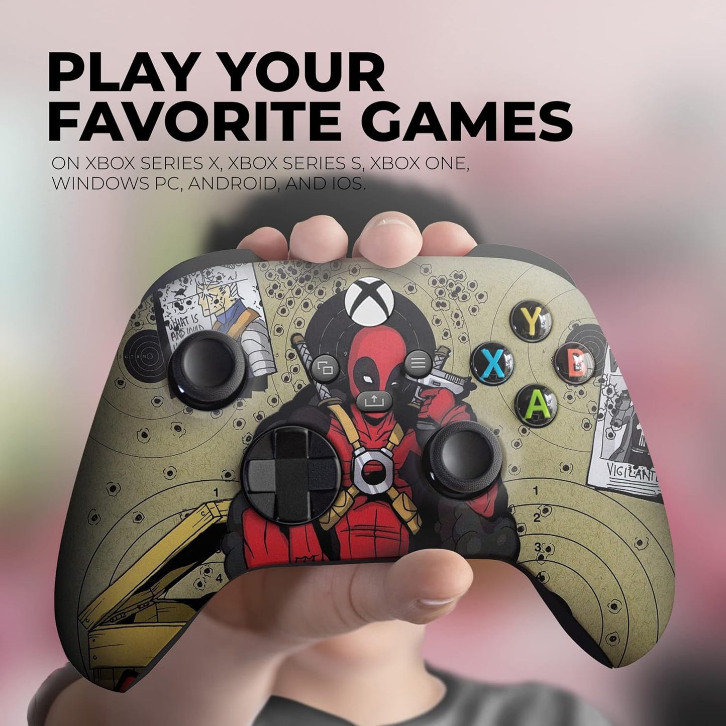 Beige Xbox controller held in hand, featuring Deadpool comic print on the front