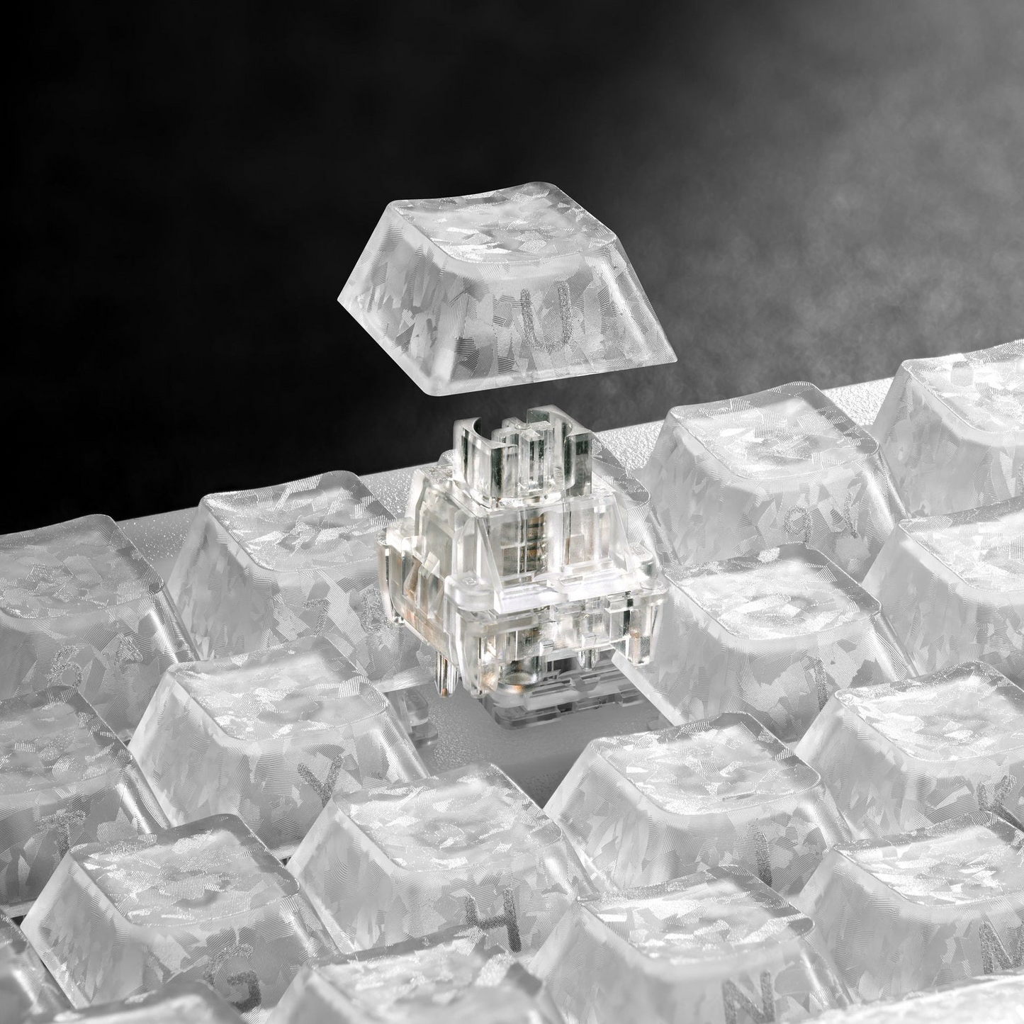 Mechanical keyboard with clear, translucent keycaps and sparkling switch housing detail