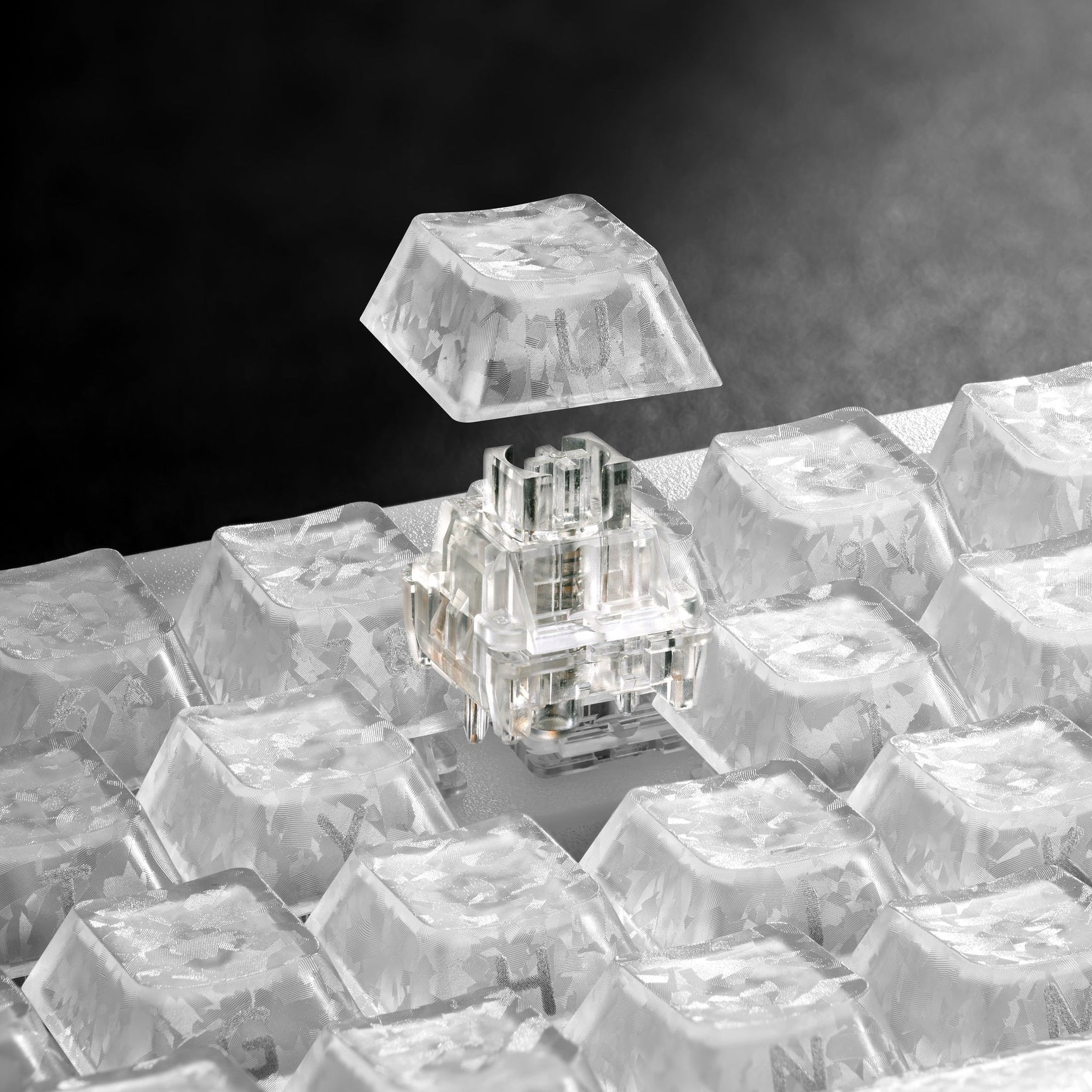Mechanical keyboard with clear, translucent keycaps and sparkling switch housing detail