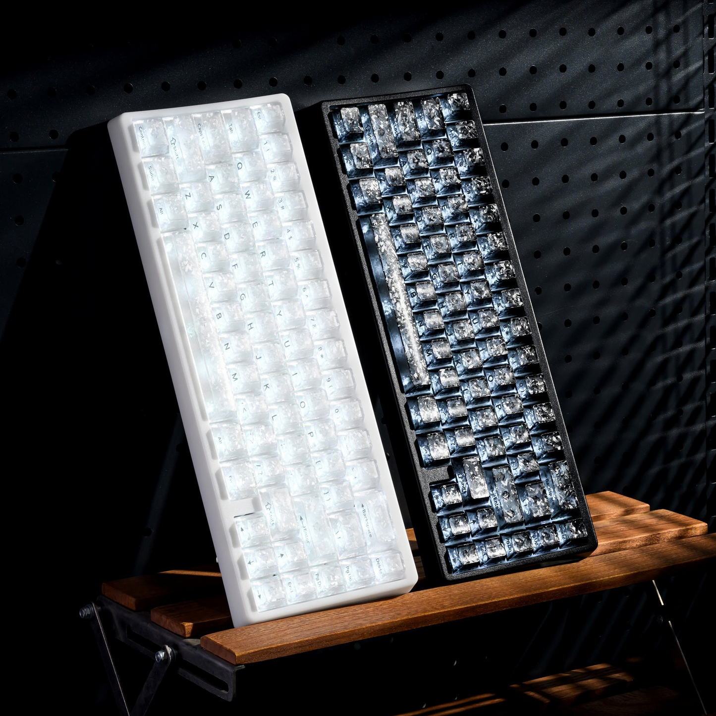 Mechanical keyboard pair with white and dark keycaps, white and blue RGB lighting