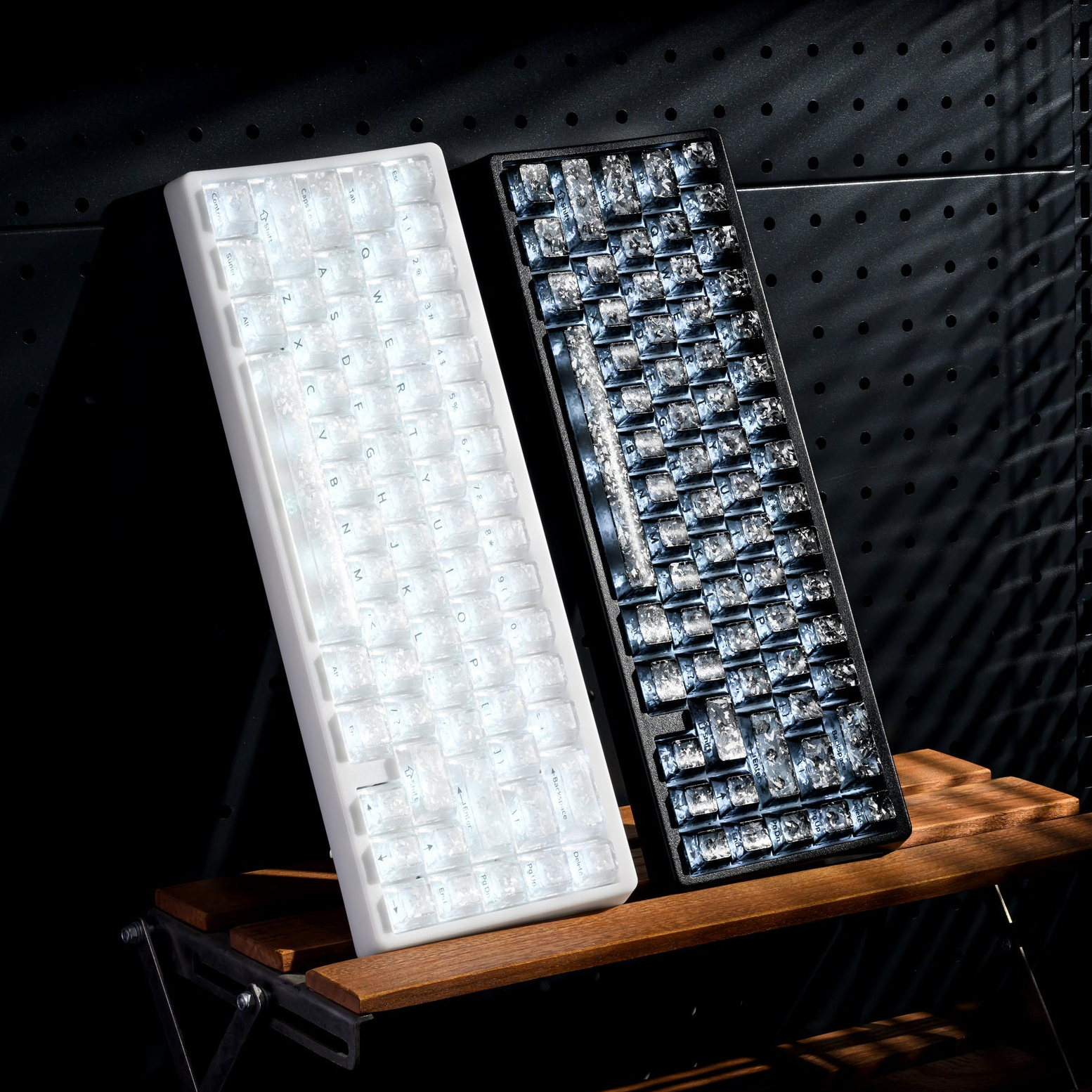 Mechanical keyboard pair with white and dark keycaps, white and blue RGB lighting