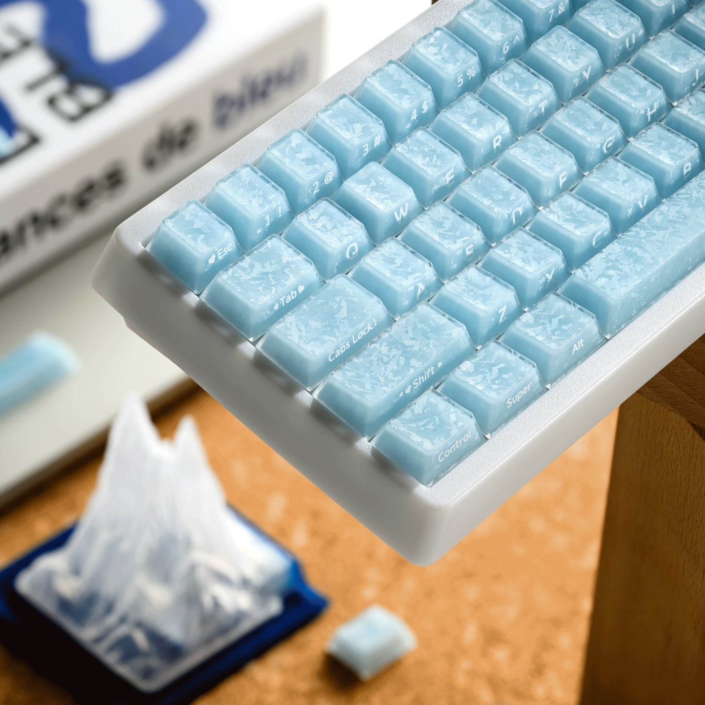 Mechanical keyboard angled view featuring light blue translucent keycaps and stabilizers