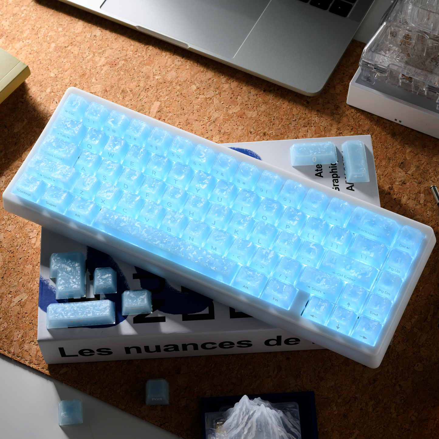 Mechanical keyboard with light blue translucent keycaps and an angled row layout