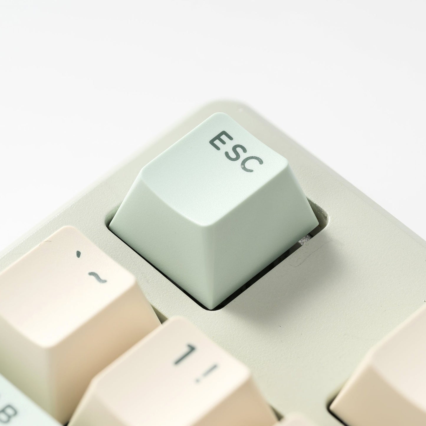 Mint double-shot PBT keycap with 'Esc' legend