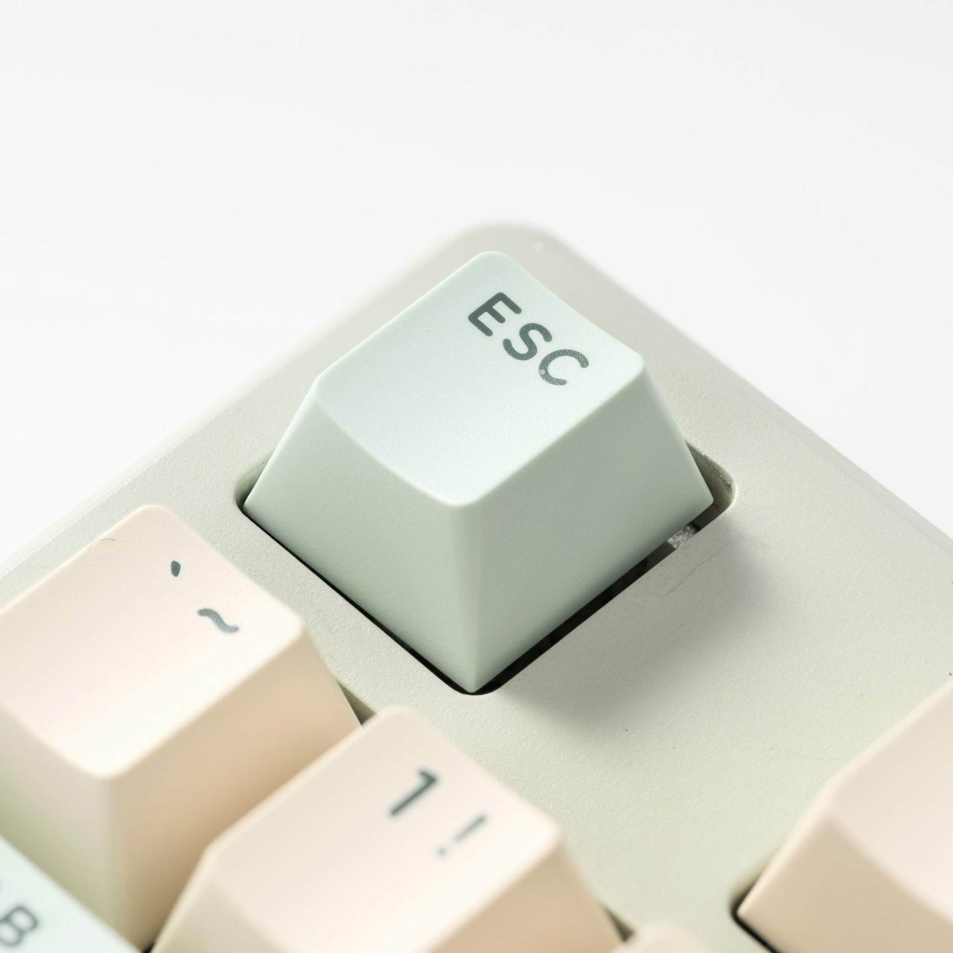 Mint double-shot PBT keycap with 'Esc' legend