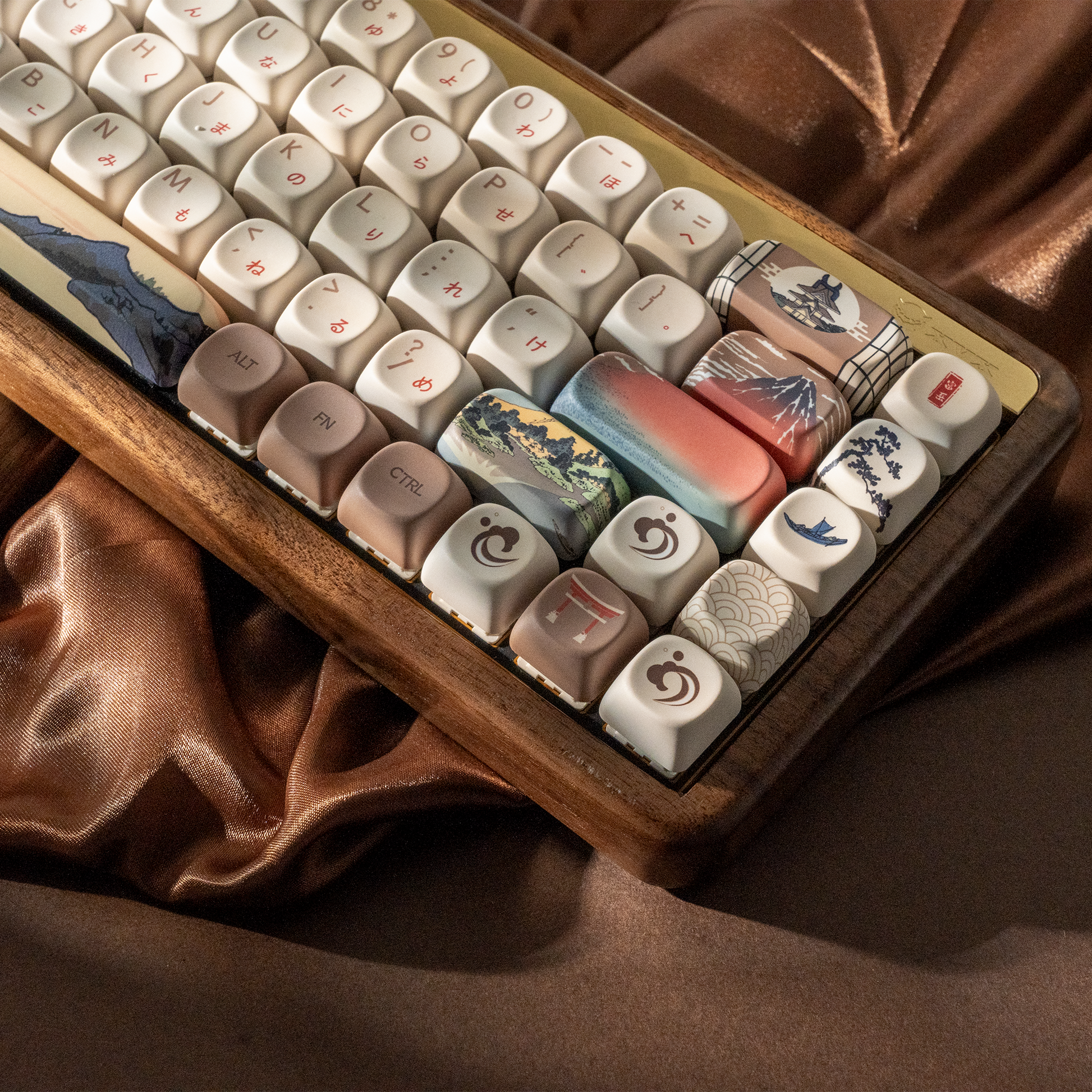 Keycap set in wooden tray with cream, gray, and blue landscape pattern caps